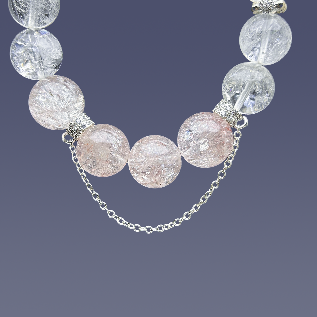 Bottom view of Blossom Valley bracelet showing the chain charm and full clear to pink azeztulite gradient.