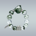 Product photo of handmade Green Phantom and Clear Quartz bracelet with silver feather charm