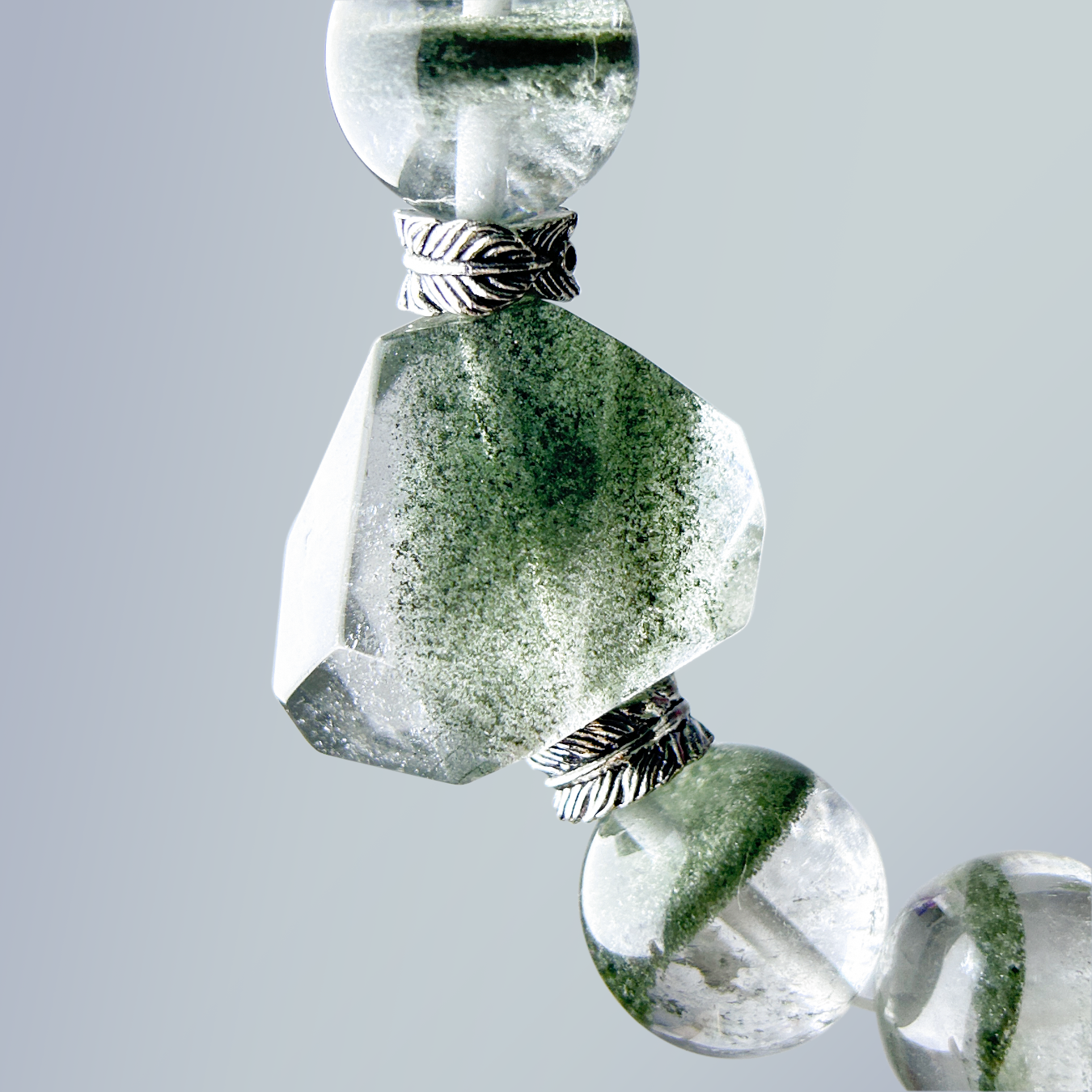 Faceted Green Phantom Quartz centerpiece close-up, showing natural textures