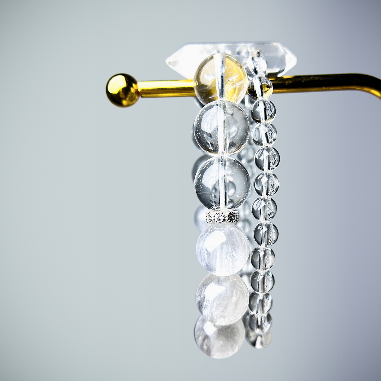 Top-down view of crystal bracelet with labradorite, Clear Quartz, white rabbit hair Rutilated Quartz