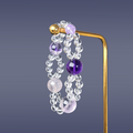 Double layered bracelet of amethyst and clear quartz on golden stand