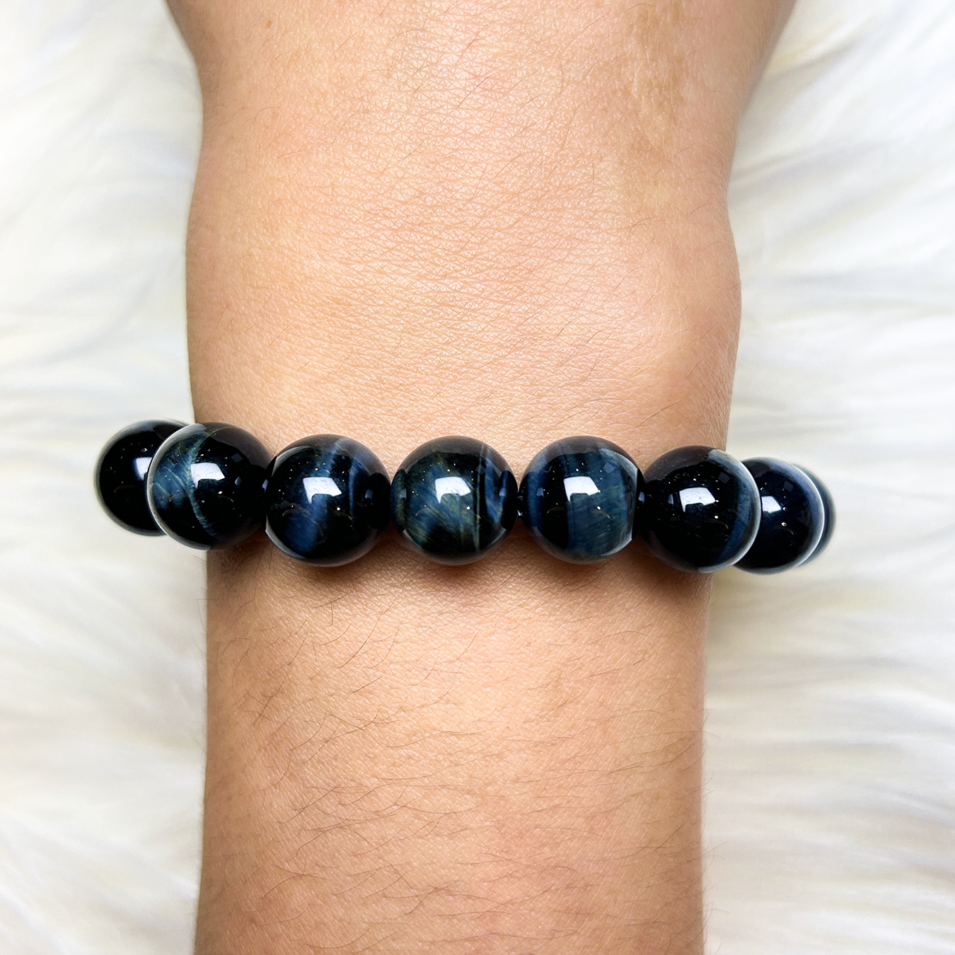 Midnight Rebel bracelet for men made with blue tiger’s eye beads worn on wrist 