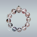 Phantom Quartz crystal bracelet in full circular layout on gradient background, featuring a pointed centerpiece and silver chain detail.
