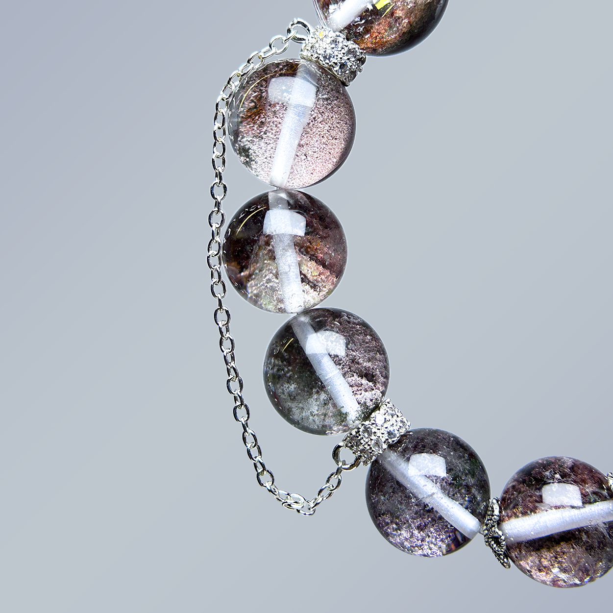 Detailed view of side chain and beads on Phantom Quartz bracelet, showcasing natural inclusions and secure silver fittings.