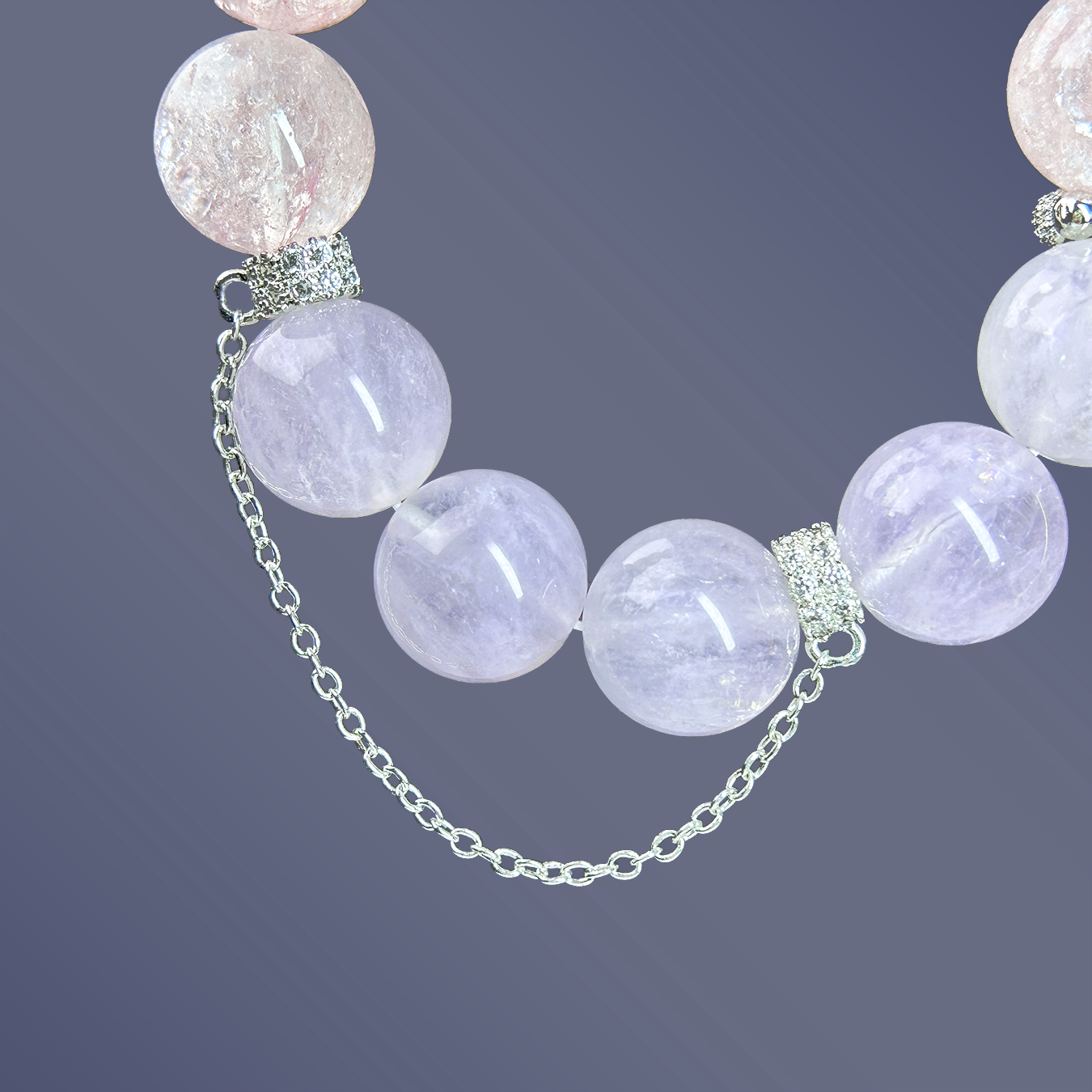 close-up of silver chain and rutilated quartz beads with rhinestone spacers from the pastel crystal bracelet.