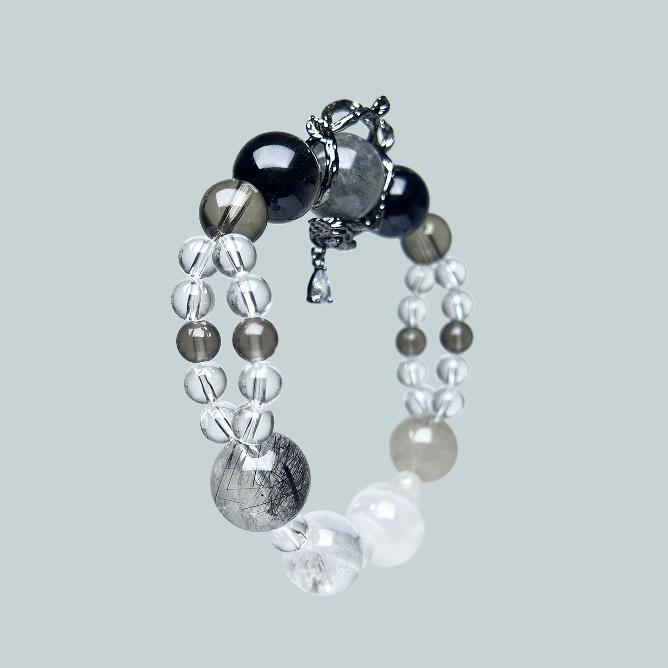 Earth tone double layred bracelet with rose drop spacer hanging side view