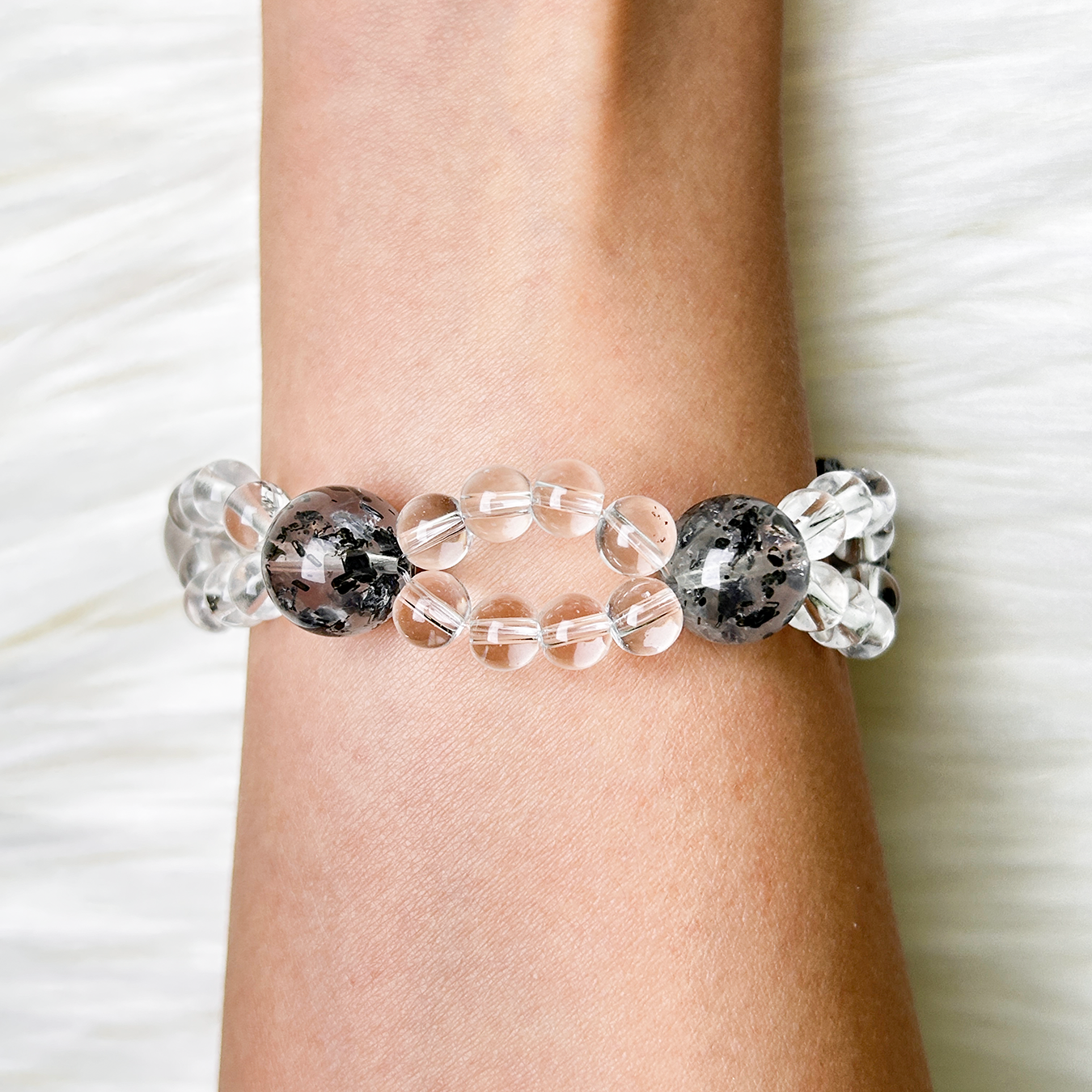 Back view of Noir Mist bracelet showing Biotite Mica and clear-quartz beads in twin strands.