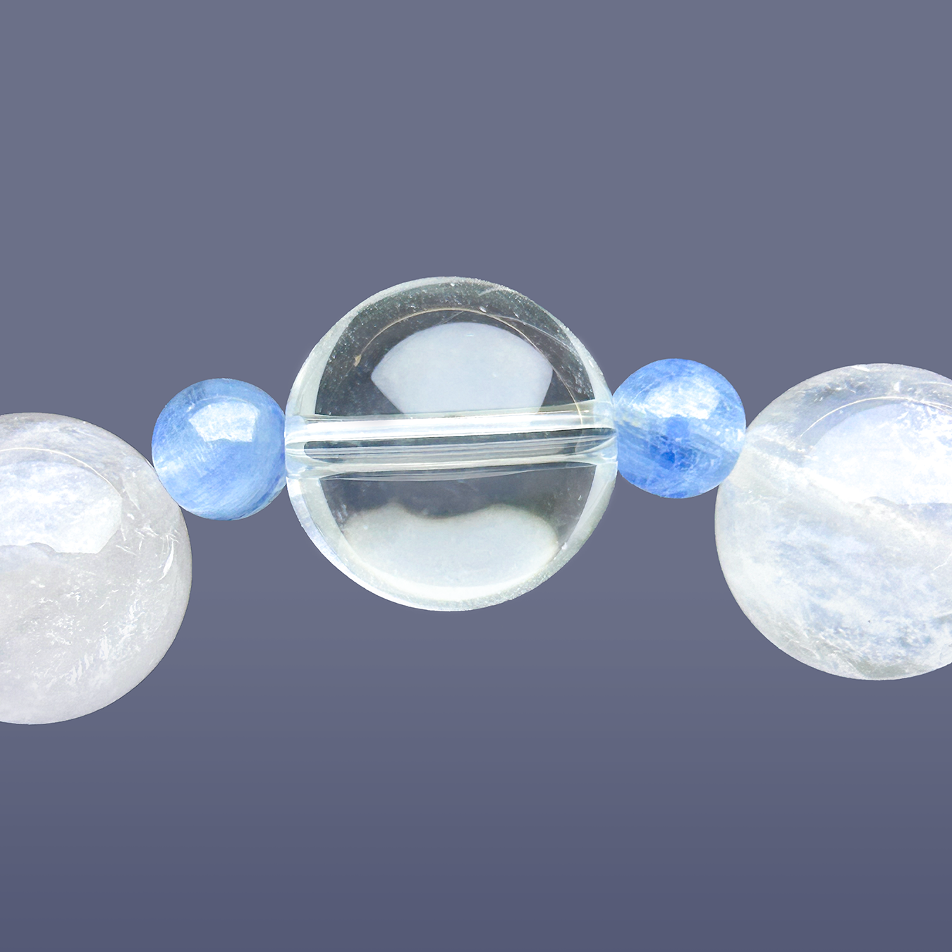 Close-up of center Clear Quartz bead with Aquamarine and White Rabbit Hair Rutilated Quartz beads