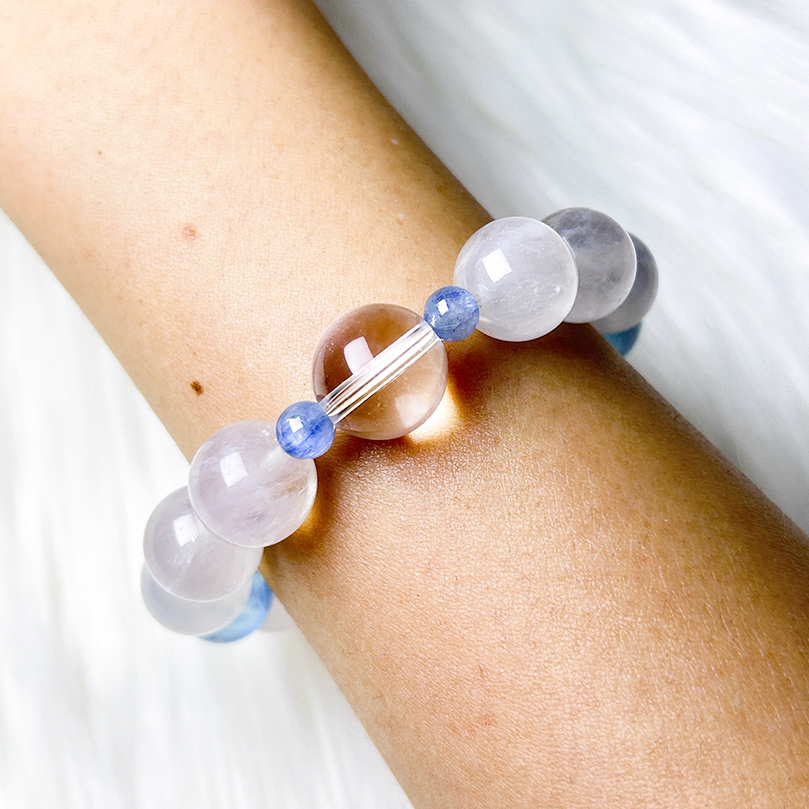 Minimalist bracelet with Aquamarine, Clear Quartz, and White Rutilated Quartz worn on wrist
