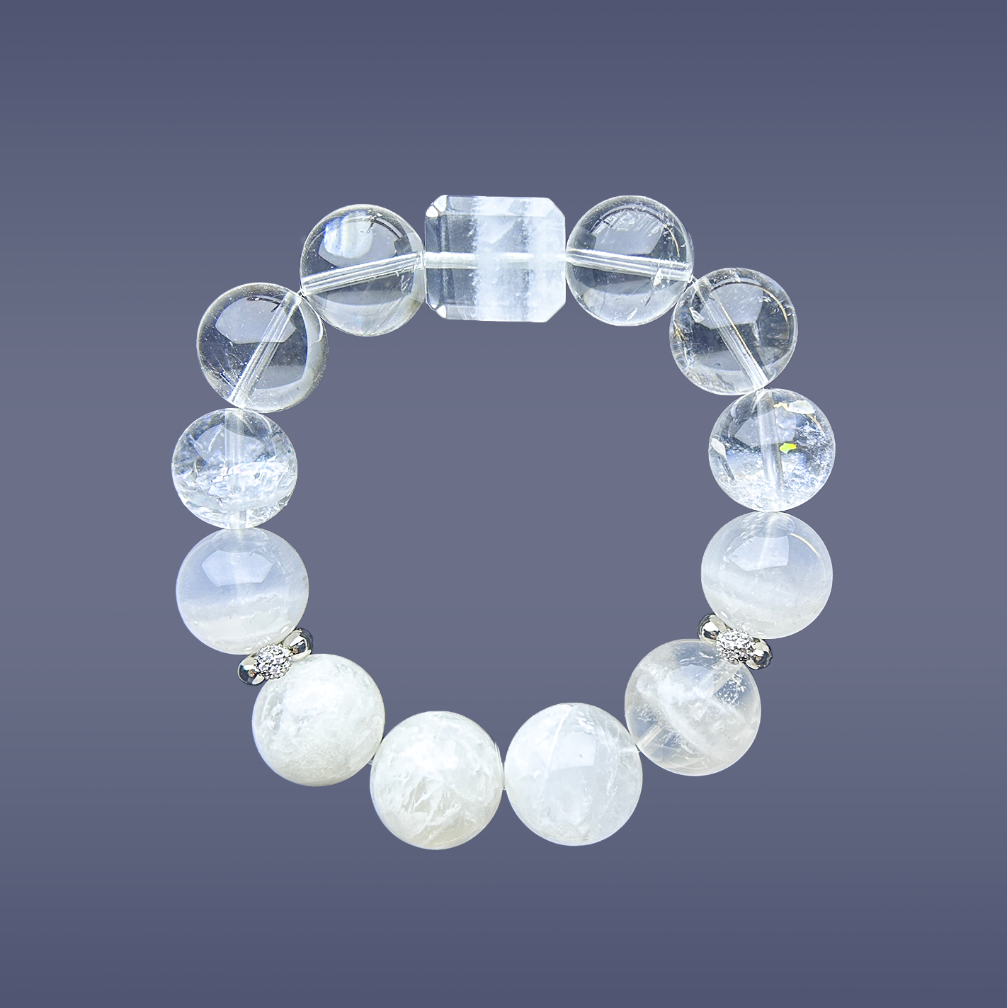 Full view of a crystal bracelet made with white phantom quartz and clear quartz, featuring a rectangular centerpiece bead and silver spacers on a soft gradient background.